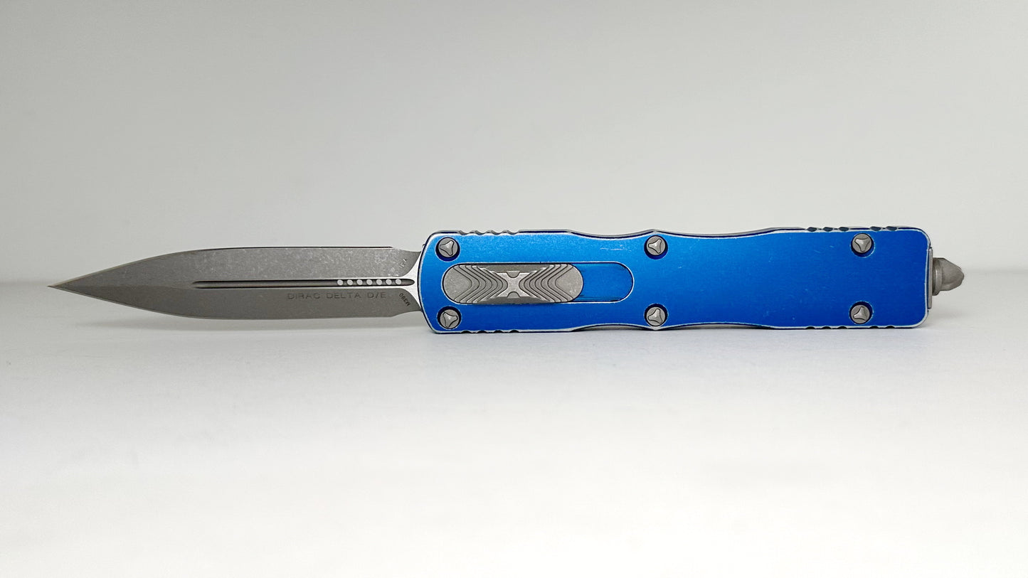 Microtech Dirac Delta 227-10DBL Pre-Owned - Apocalyptic Bohler M390 Double Edge Dagger Blade & Distressed Blue 6061-T6 Aluminum Handle - Out the Front Automatic | Made in USA