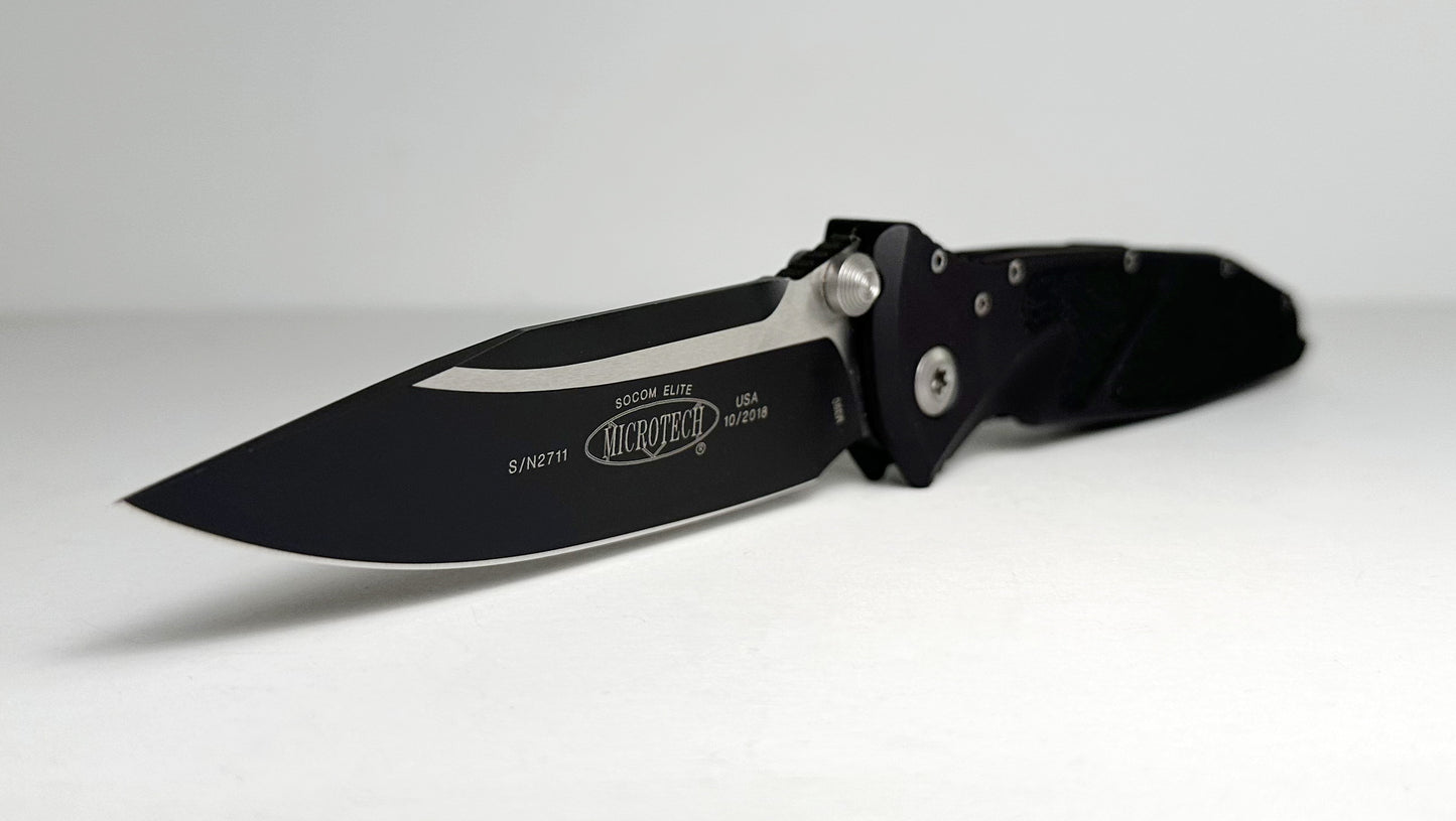 Microtech SOCOM Elite Manual 160-1 Pre-Owned - Black Coated 4.05" Bohler M390 Clip Point Blade & Black Aluminum Handle w/ Grip Inserts - Liner Lock Manual w/ Dual Thumb Studs | Made in USA