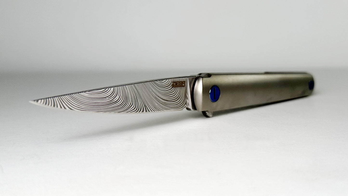 Zieba MS3 Pro EDC Flipper Damasteel Pre-Owned - Twist-Patterned 2.75" Damasteel Blade & Blasted Titanium Handle - Blue Ti Hardware & Carbon Fiber Backspacer | Made in USA