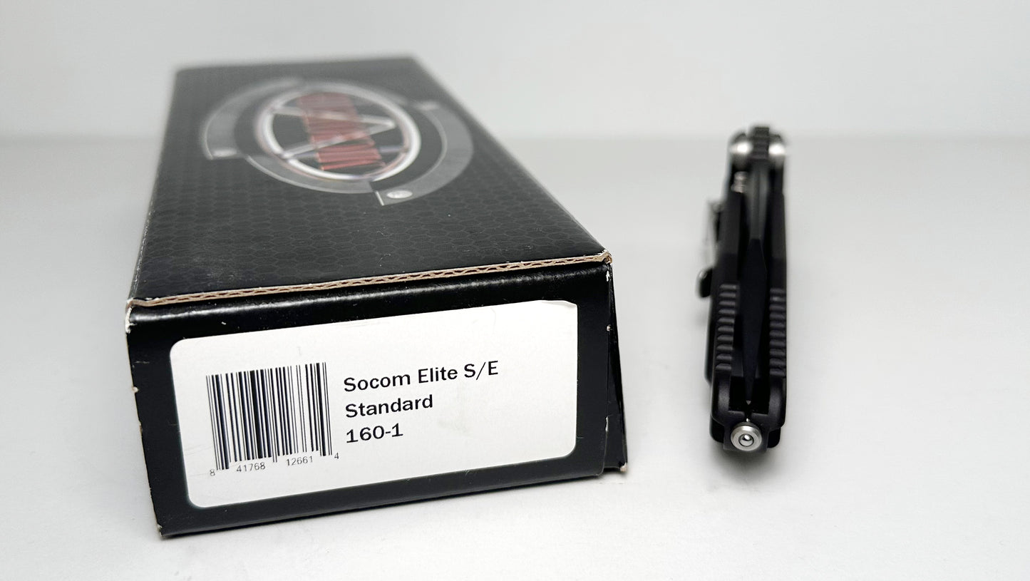 Microtech SOCOM Elite Manual 160-1 Pre-Owned - Black Coated 4.05" Bohler M390 Clip Point Blade & Black Aluminum Handle w/ Grip Inserts - Liner Lock Manual w/ Dual Thumb Studs | Made in USA