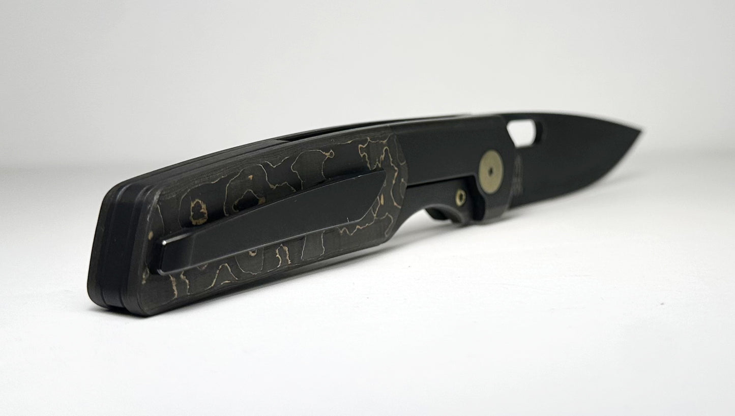 Berg Blades | NRD Sweeney Pre-Owned SN #21/60 - Black PVD CPM-20CV Drop Point Blade - Black 6AL-4V Titanium Handle w/ Gold Camo Fat Carbon Fiber Inlays & Gold Anodized Hardware - Ti Frame Lock w/ Flipper Tab | Made in China by Reate