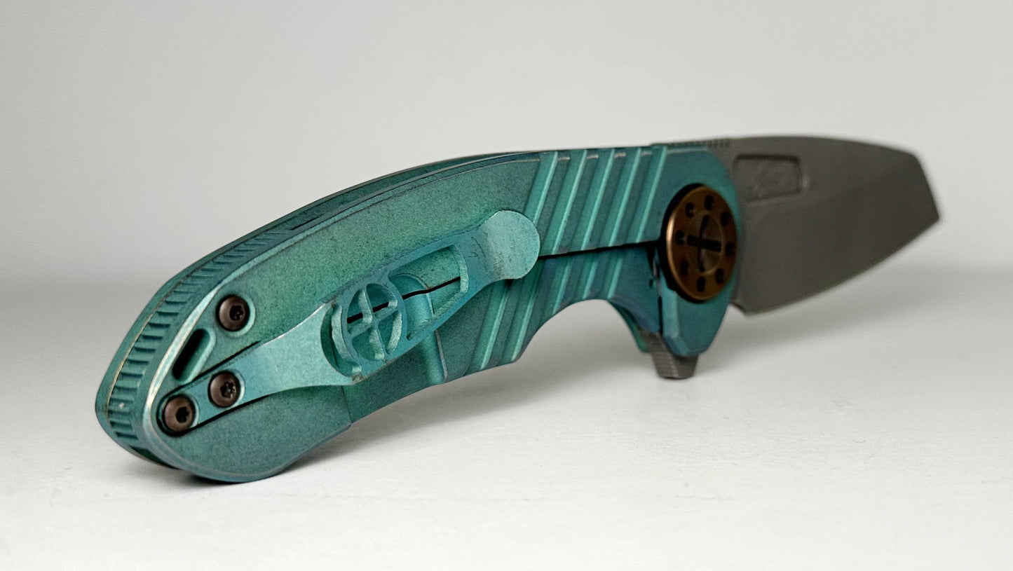 Curtiss Knives Custom F3 Med Wharny Flipper Pre-Owned - Blasted CPM Magnacut Wharncliffe Blade - Antique Green Titanium Slide-Milled Handle Scales w/ Root Beer Hardware - Frame Lock Flipper | Made in USA