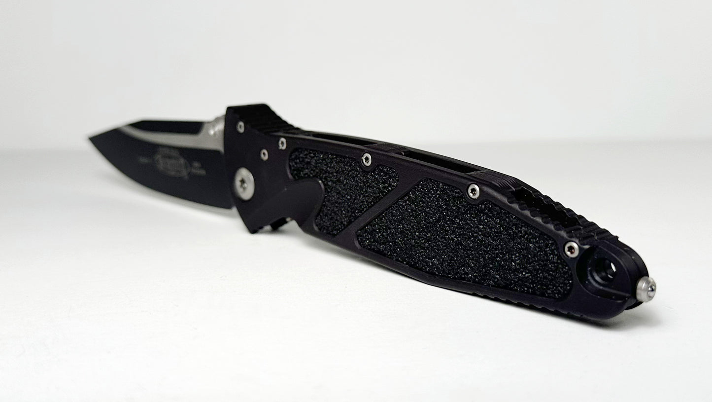 Microtech SOCOM Elite Manual 160-1 Pre-Owned - Black Coated 4.05" Bohler M390 Clip Point Blade & Black Aluminum Handle w/ Grip Inserts - Liner Lock Manual w/ Dual Thumb Studs | Made in USA