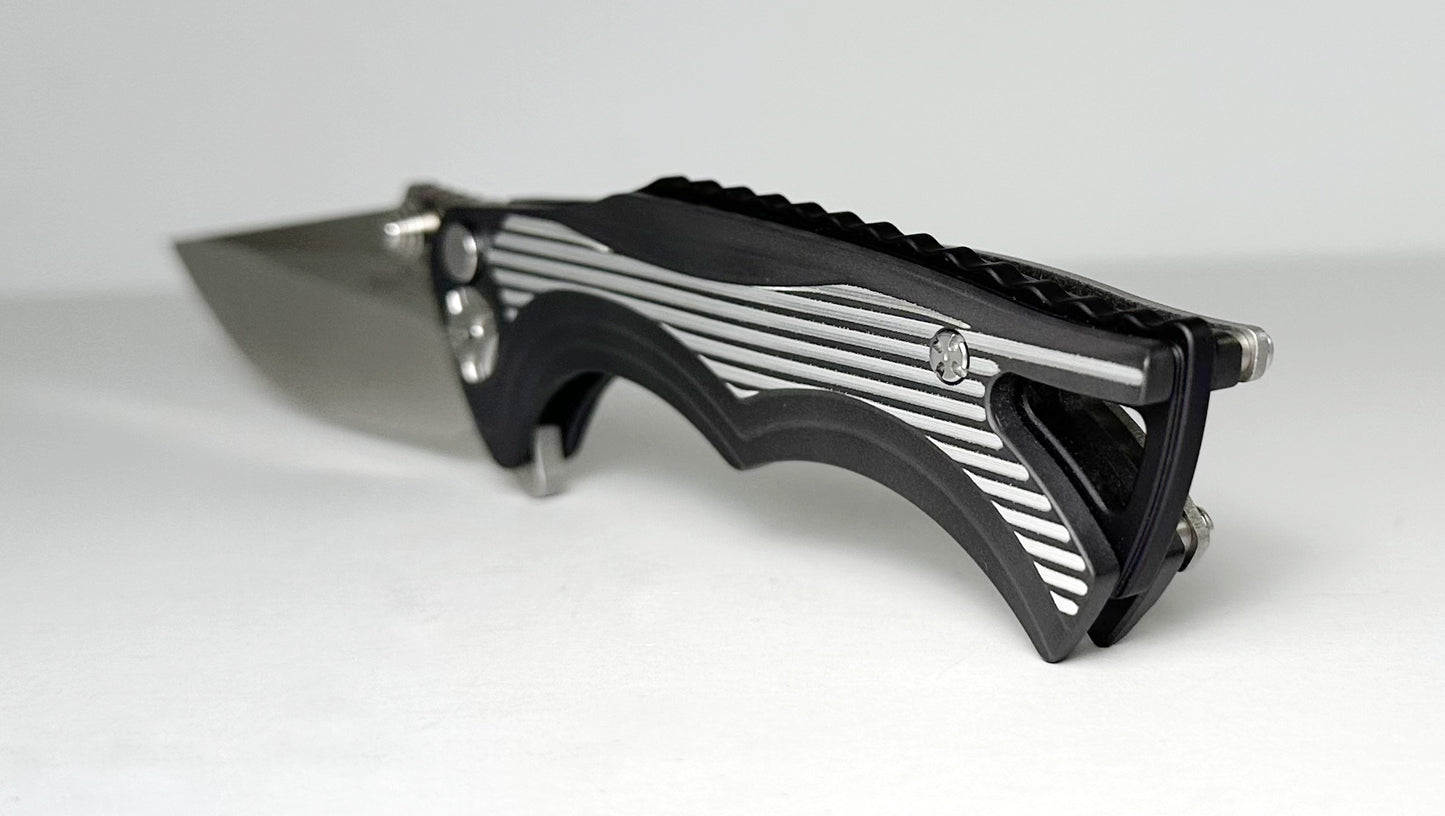 Brian Tighe & Friends Small Tighe Fighter Flipper Pre-Owned #0247 - Stonewash 154CM Drop Point Blade & Black/Grey Bright Aluminum Handles - Button Lock Folder w/ Flipper Tab | Made in USA