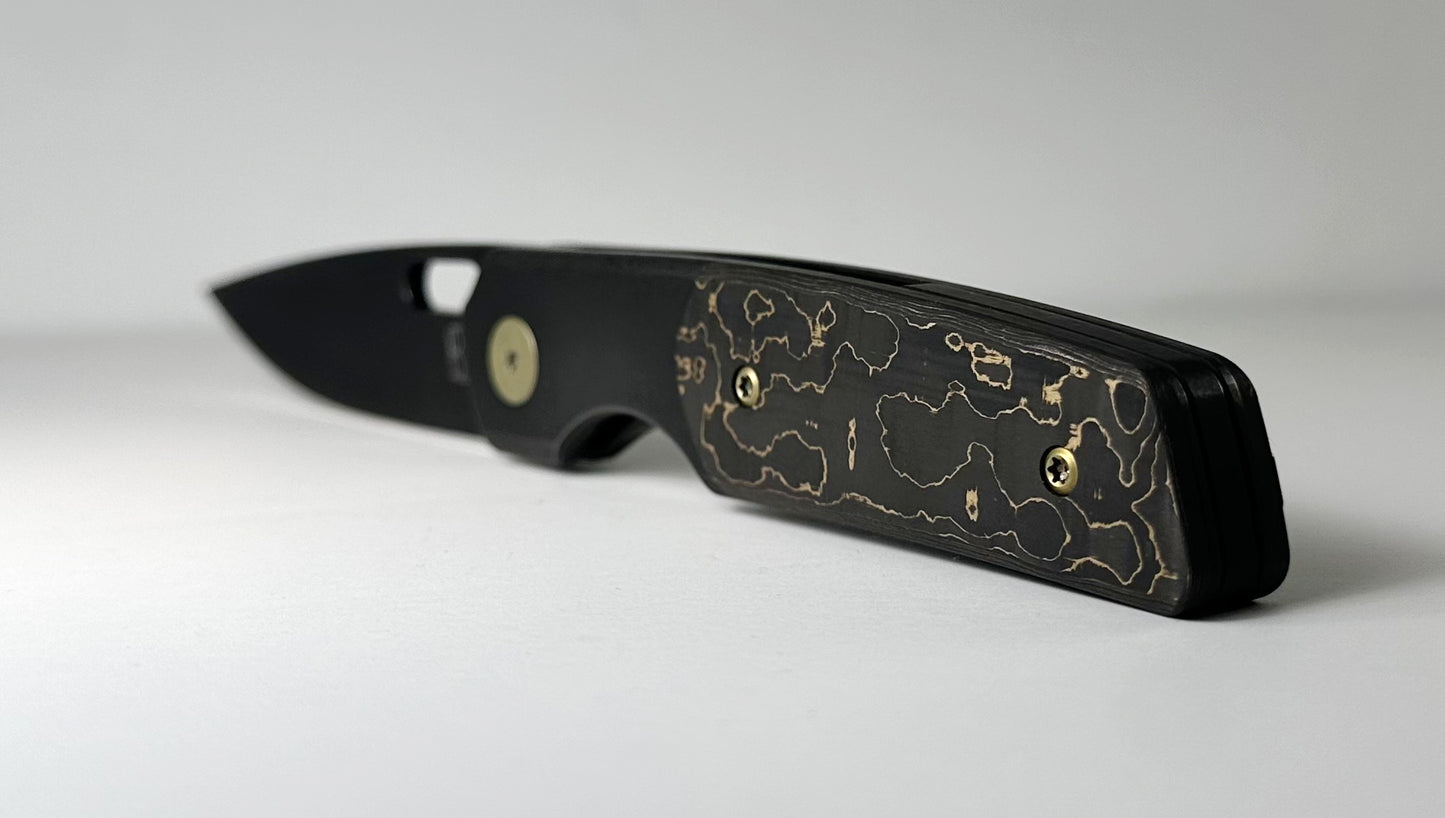 Berg Blades | NRD Sweeney Pre-Owned SN #21/60 - Black PVD CPM-20CV Drop Point Blade - Black 6AL-4V Titanium Handle w/ Gold Camo Fat Carbon Fiber Inlays & Gold Anodized Hardware - Ti Frame Lock w/ Flipper Tab | Made in China by Reate