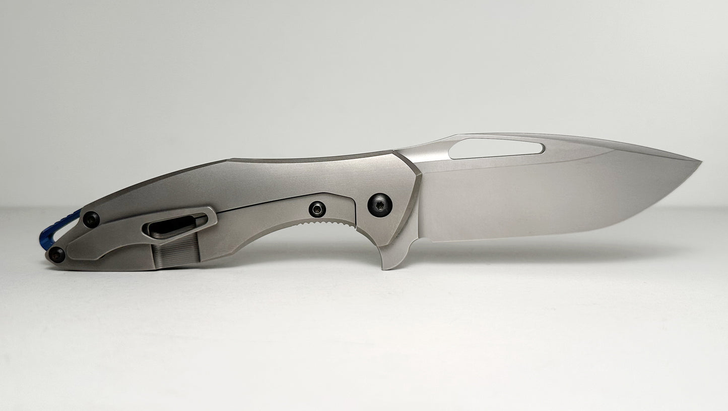 Koenig Arius Gen 2 Frame Lock Flipper Pre-Owned - Stonewash CTS-XHP Drop Point & 3D Contoured Titanium Handle - Blue Backspacer & Black Pivot | Made in USA