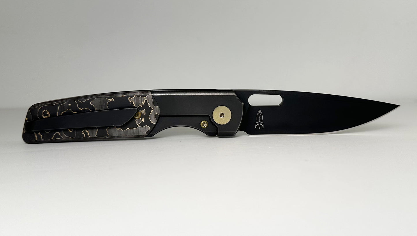 Berg Blades | NRD Sweeney Pre-Owned SN #21/60 - Black PVD CPM-20CV Drop Point Blade - Black 6AL-4V Titanium Handle w/ Gold Camo Fat Carbon Fiber Inlays & Gold Anodized Hardware - Ti Frame Lock w/ Flipper Tab | Made in China by Reate