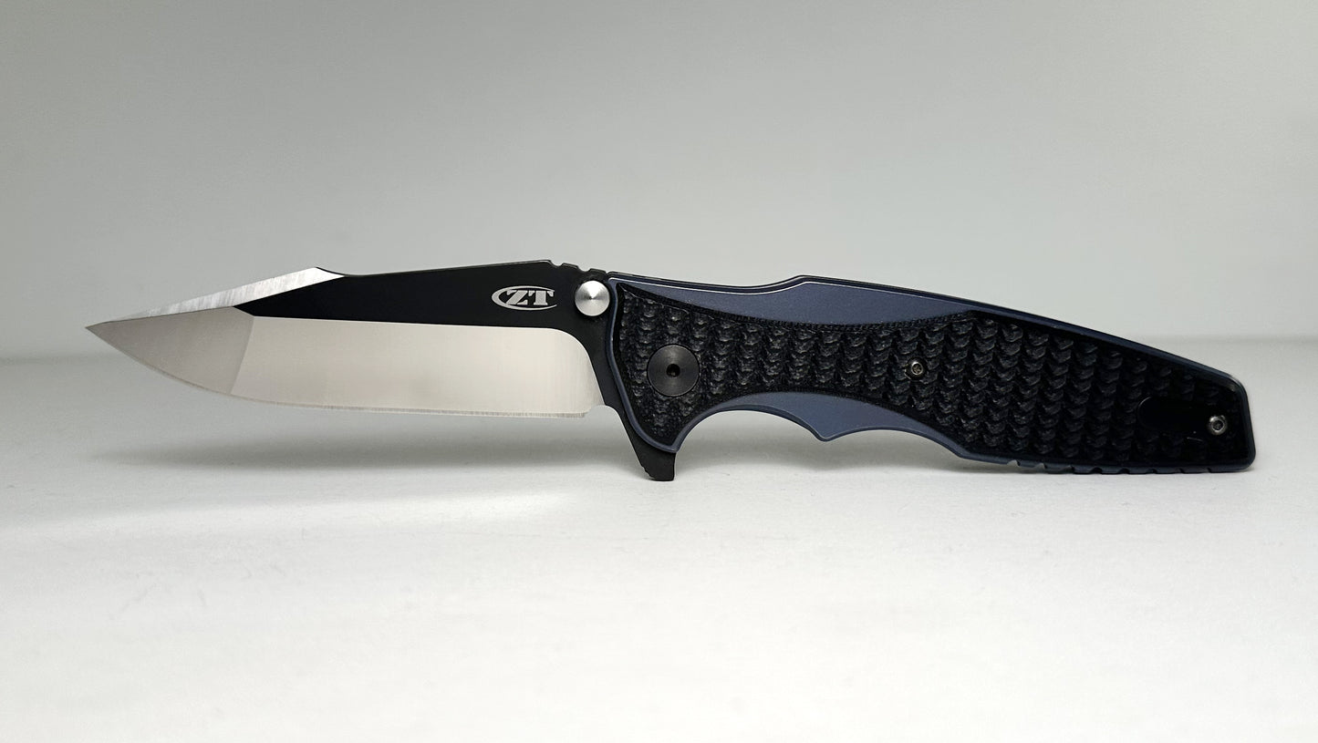 Zero Tolerance | Rick Hinderer 0393 Pre-Owned - Two-Toned 3.5" CPM-20CV Harpoon Point Blade - Blue Ano Titanium Handle w/ Machined Black G-10 Overlays - KVT Frame Lock Folder w/ Dual Studs & Flipper Tab | Made in USA