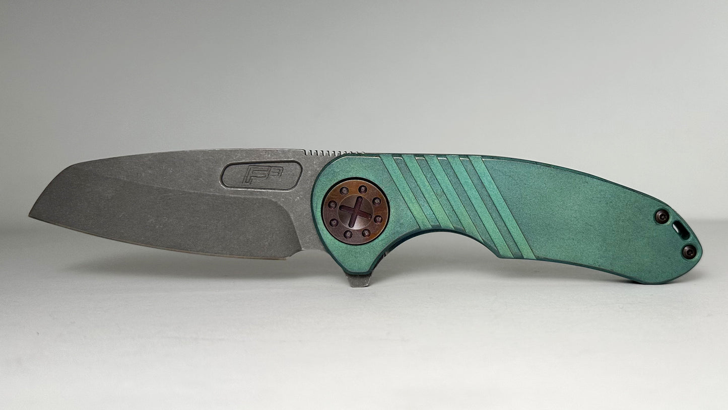 Curtiss Knives Custom F3 Med Wharny Flipper Pre-Owned - Blasted CPM Magnacut Wharncliffe Blade - Antique Green Titanium Slide-Milled Handle Scales w/ Root Beer Hardware - Frame Lock Flipper | Made in USA