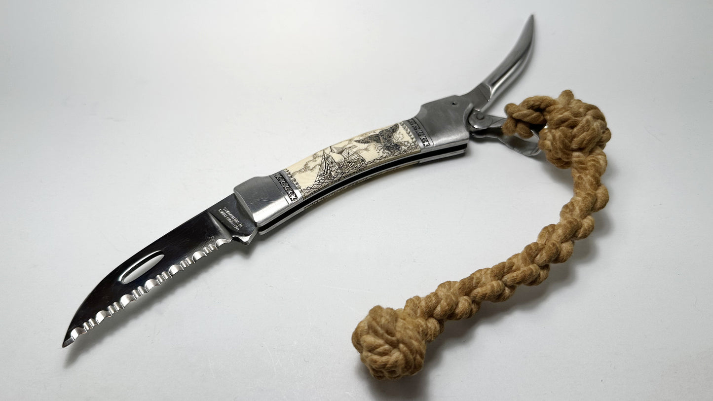 Sam McDowell Rigger Blade "Watching the Whales" Scrimshaw Pre-Owned USED - Satin Surgical Steel Serrated Saw Blade - Marlin Spike w/ Sailor-made Rope & Unoriginal Nylon Sheath | Made in Seki-City, Japan
