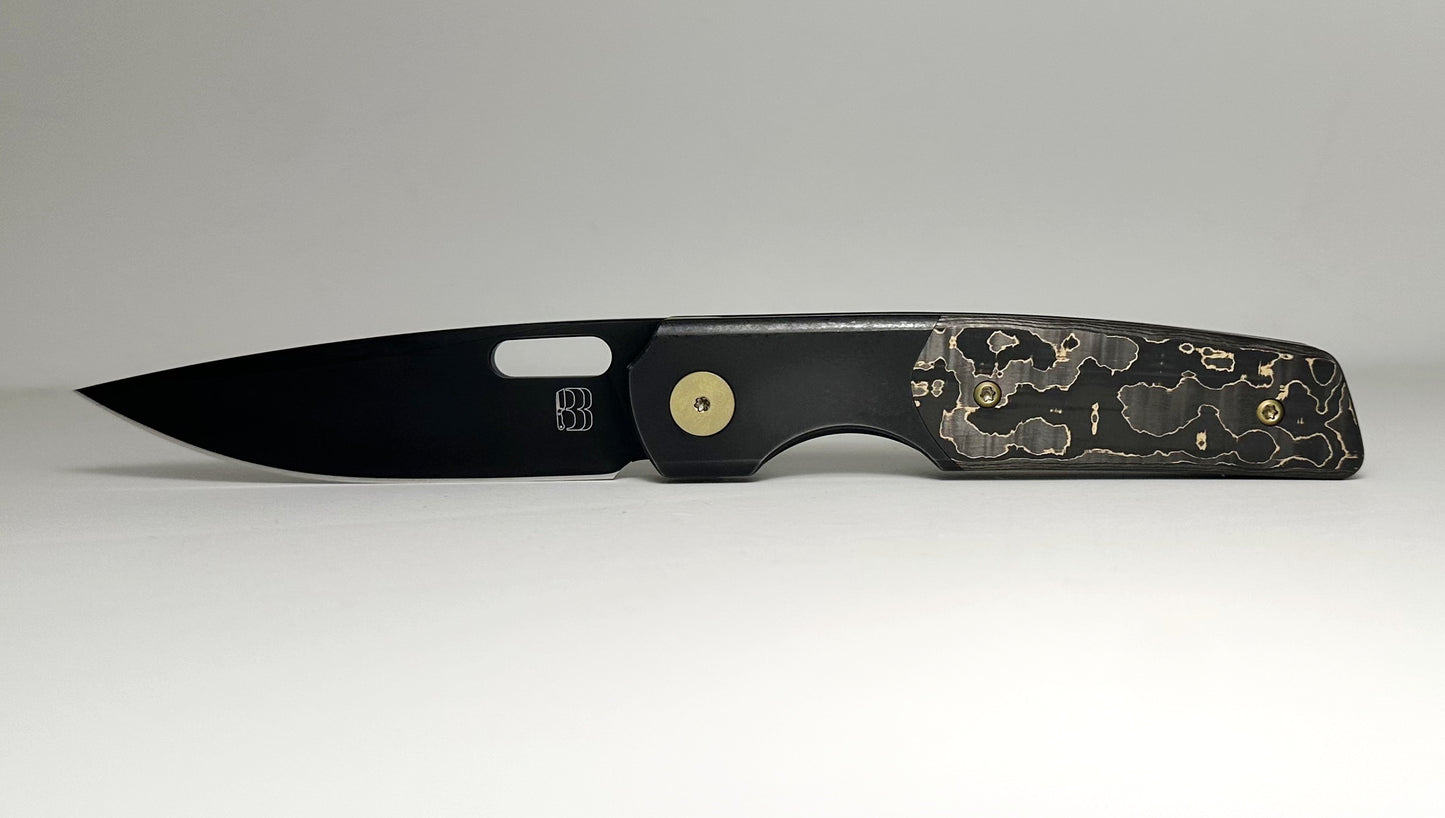 Berg Blades | NRD Sweeney Pre-Owned SN #21/60 - Black PVD CPM-20CV Drop Point Blade - Black 6AL-4V Titanium Handle w/ Gold Camo Fat Carbon Fiber Inlays & Gold Anodized Hardware - Ti Frame Lock w/ Flipper Tab | Made in China by Reate