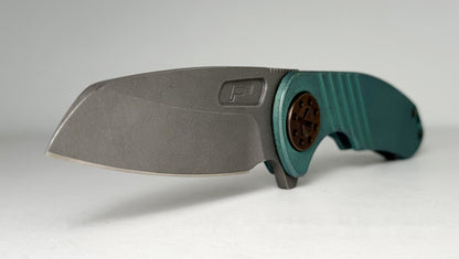 Curtiss Knives Custom F3 Med Wharny Flipper Pre-Owned - Blasted CPM Magnacut Wharncliffe Blade - Antique Green Titanium Slide-Milled Handle Scales w/ Root Beer Hardware - Frame Lock Flipper | Made in USA