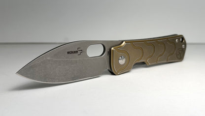 Boker Plus | Serge Panchenko Gust Pre-Owned NO BOX 01BO082 - Stonewash 2.75" CPM-D2 Drop Point Blade & Bronze Finished Stainless Steel Handle - Frame Lock Folder w/ Blade Hole | Made in China