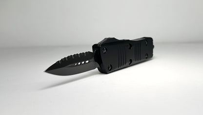 Microtech Troodon Mini Signature Series OTF Shadow Pre-Owned 238-3 DLCTSH - Black DLC Coated 1.9" 1-Side Fully Serrated Dagger Blade & Black Aluminum Handle w/ DLC Hardware | Made in USA