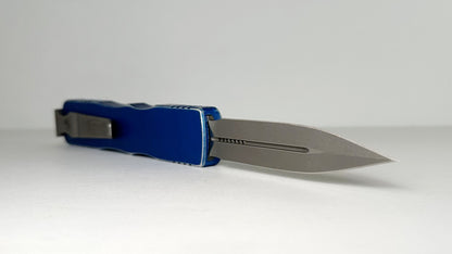 Microtech Dirac Delta 227-10DBL Pre-Owned - Apocalyptic Bohler M390 Double Edge Dagger Blade & Distressed Blue 6061-T6 Aluminum Handle - Out the Front Automatic | Made in USA