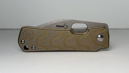 Boker Plus | Serge Panchenko Gust Pre-Owned NO BOX 01BO082 - Stonewash 2.75" CPM-D2 Drop Point Blade & Bronze Finished Stainless Steel Handle - Frame Lock Folder w/ Blade Hole | Made in China