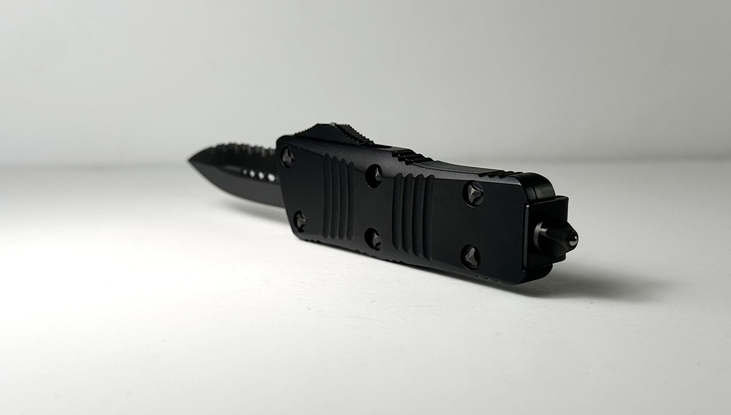 Microtech Troodon Mini Signature Series OTF Shadow Pre-Owned 238-3 DLCTSH - Black DLC Coated 1.9" 1-Side Fully Serrated Dagger Blade & Black Aluminum Handle w/ DLC Hardware | Made in USA