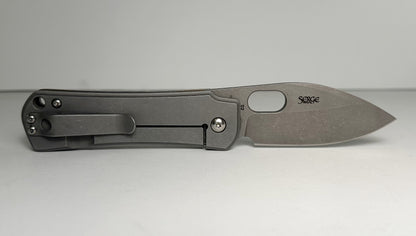 Boker Plus | Serge Panchenko Gust Pre-Owned NO BOX 01BO082 - Stonewash 2.75" CPM-D2 Drop Point Blade & Bronze Finished Stainless Steel Handle - Frame Lock Folder w/ Blade Hole | Made in China