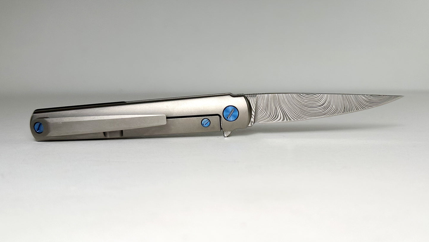 Zieba MS3 Pro EDC Flipper Damasteel Pre-Owned - Twist-Patterned 2.75" Damasteel Blade & Blasted Titanium Handle - Blue Ti Hardware & Carbon Fiber Backspacer | Made in USA